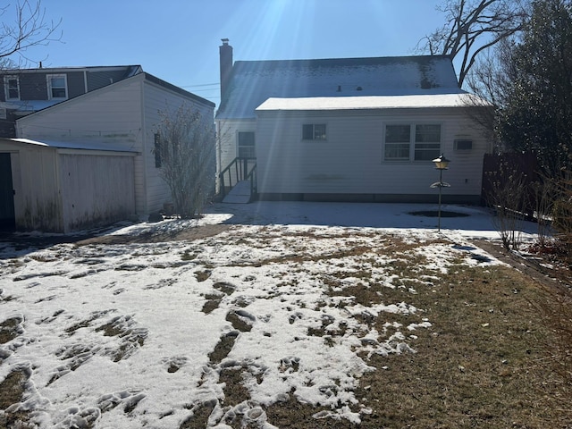 view of snow covered house