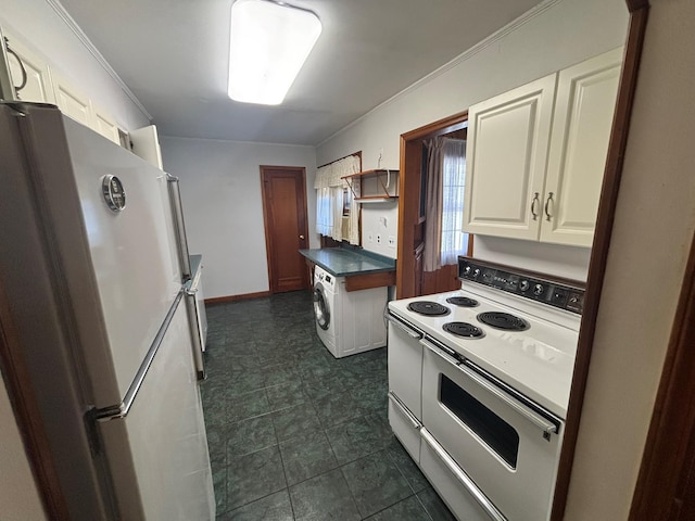 kitchen with refrigerator, ornamental molding, white cabinets, washer / clothes dryer, and range with two ovens