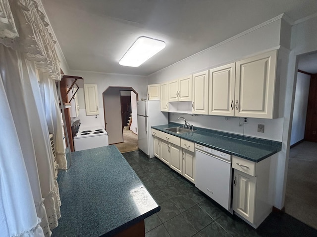 kitchen featuring washer / clothes dryer, sink, white cabinets, crown molding, and white appliances