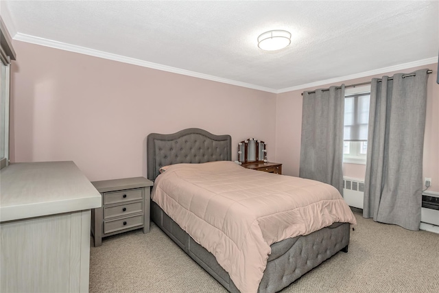 carpeted bedroom with radiator, ornamental molding, and a textured ceiling