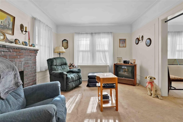 living room featuring carpet floors and a brick fireplace