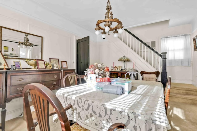 dining space featuring an inviting chandelier