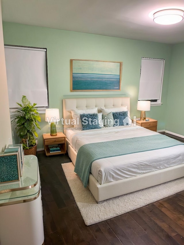 bedroom with dark wood-type flooring