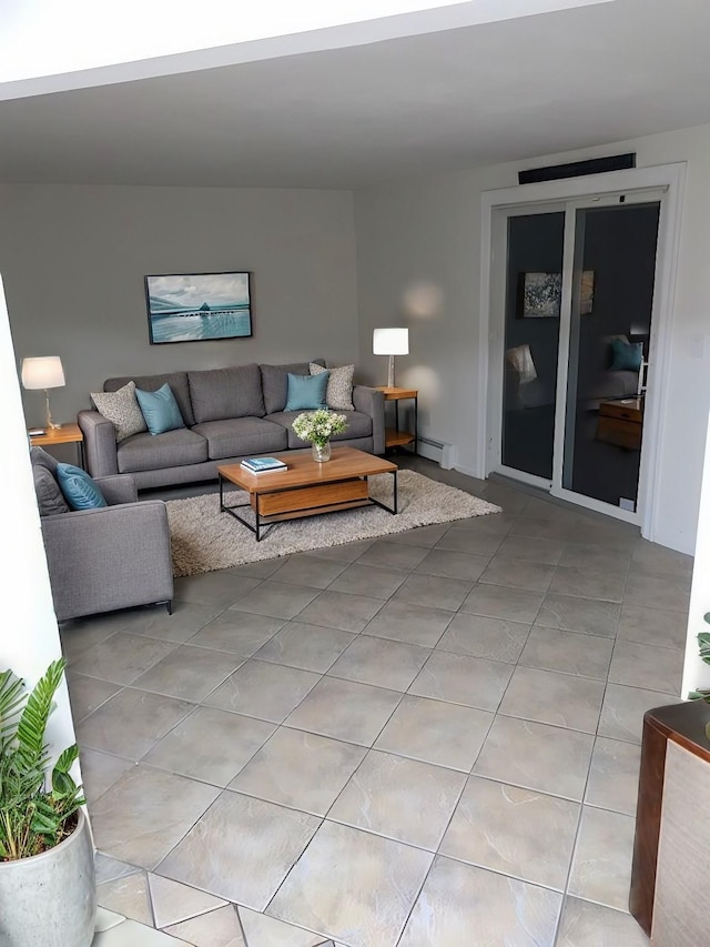 living room featuring a baseboard heating unit