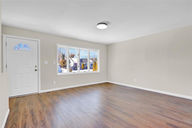 entrance foyer featuring dark wood-type flooring