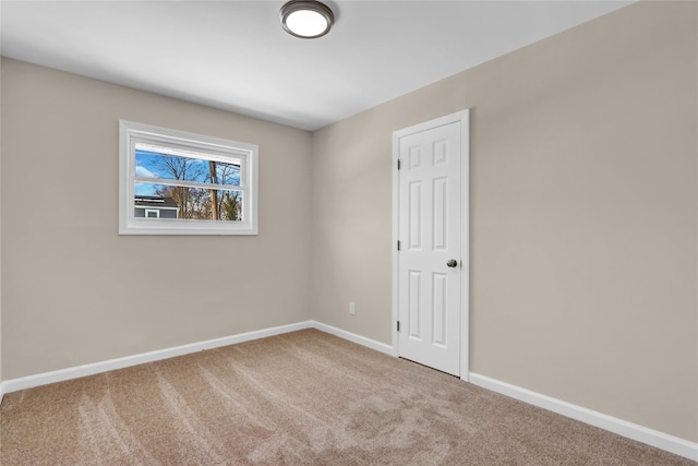 empty room with carpet flooring