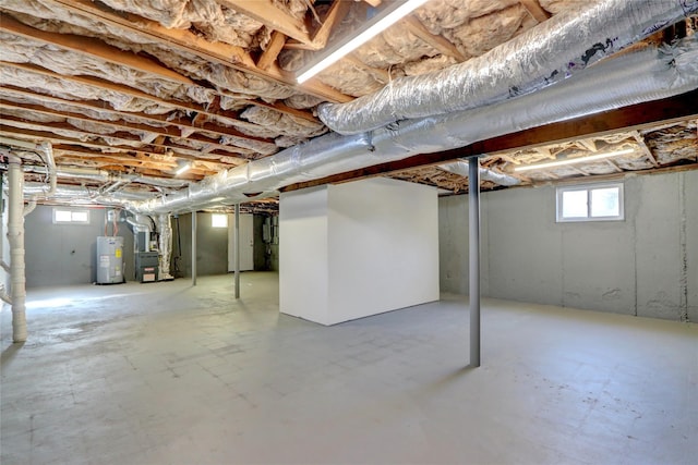 basement with water heater and heating unit