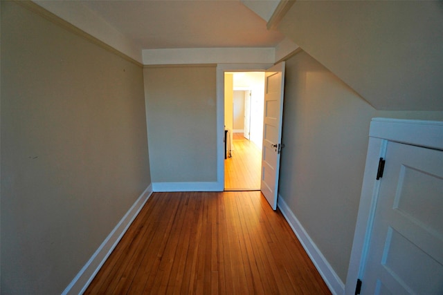 bonus room with hardwood / wood-style flooring and lofted ceiling