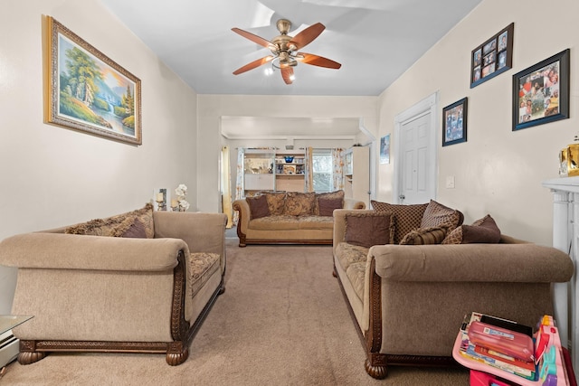 carpeted living room with ceiling fan