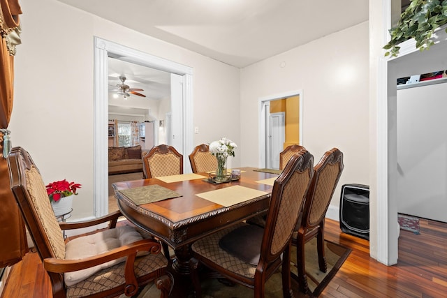 dining area featuring hardwood / wood-style flooring and ceiling fan