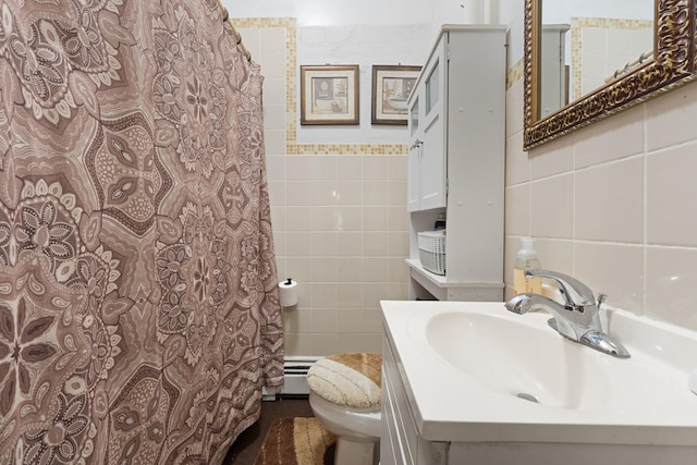 bathroom with tile walls, vanity, baseboard heating, walk in shower, and toilet