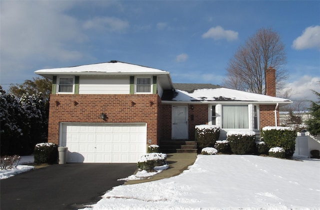 split level home featuring a garage