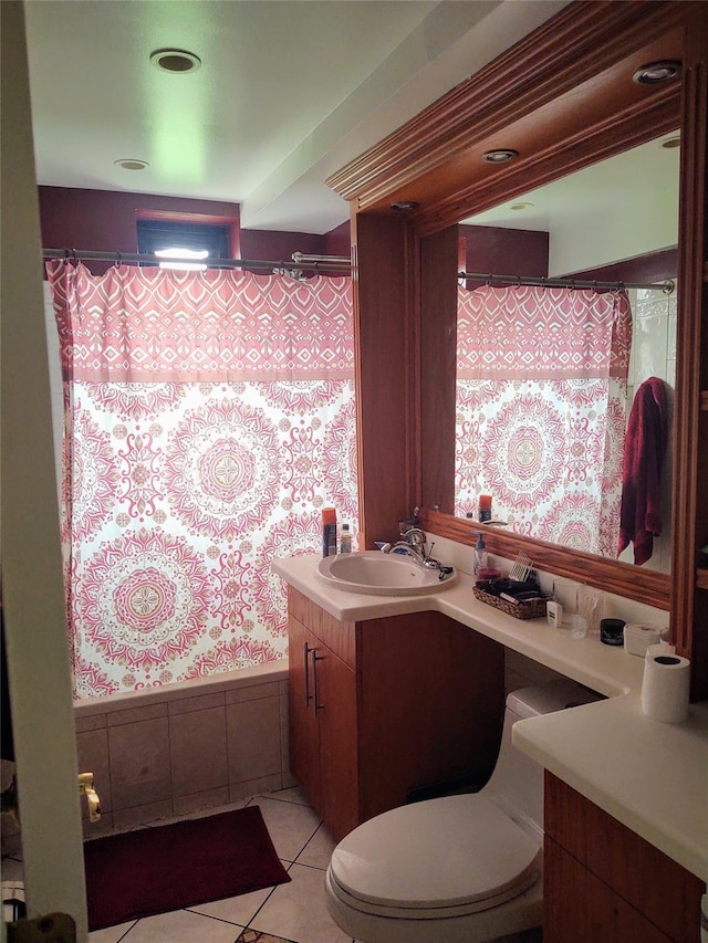 bathroom with tile patterned floors, toilet, vanity, and a shower with curtain