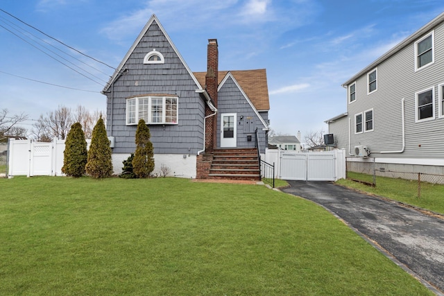 320 Miller Ave, Freeport, NY 11520 - view of front of property with a front lawn