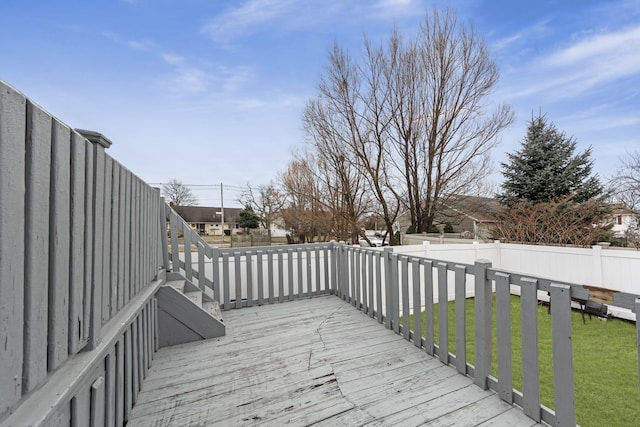 wooden terrace featuring a yard