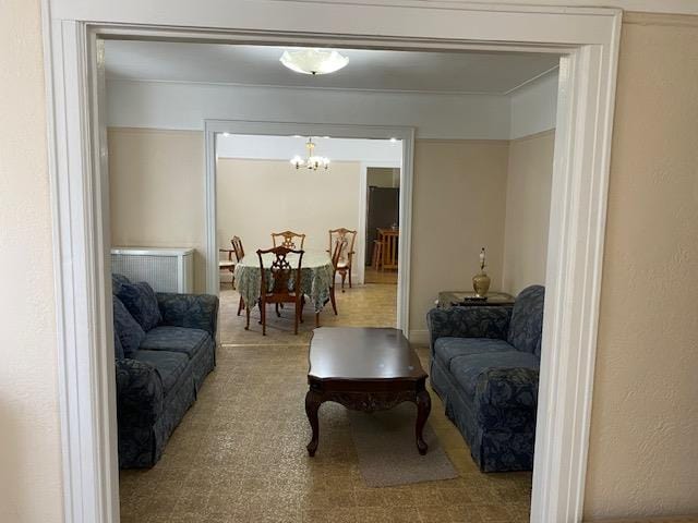 living area with an inviting chandelier