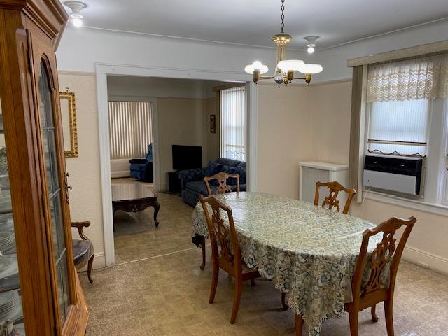 dining space featuring an inviting chandelier