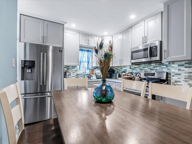 kitchen featuring decorative backsplash and stainless steel appliances