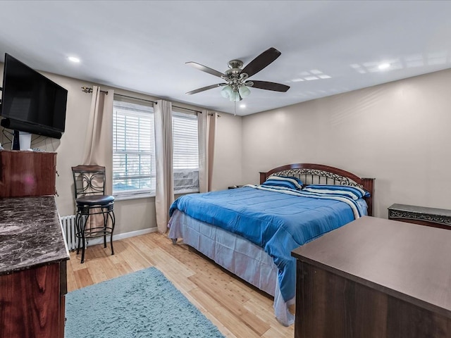 bedroom featuring ceiling fan and light wood-type flooring