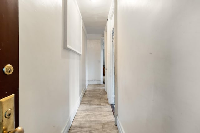 corridor featuring crown molding