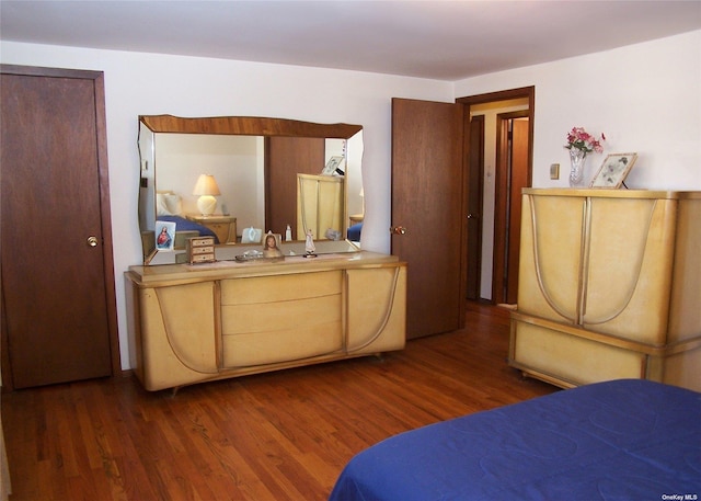 bedroom featuring dark hardwood / wood-style flooring