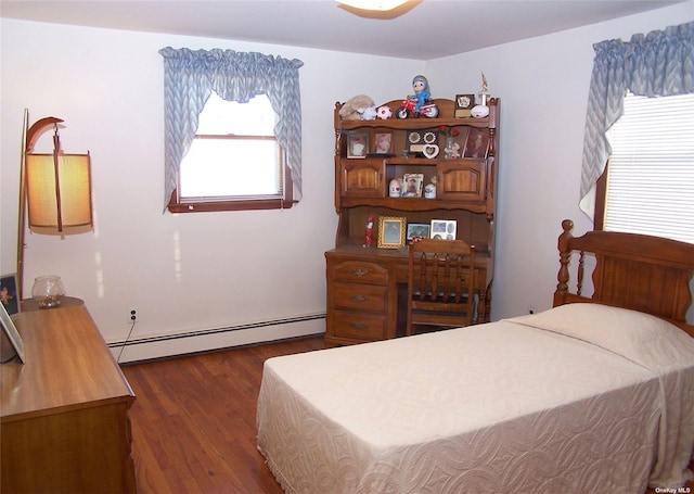 bedroom featuring dark hardwood / wood-style floors and a baseboard radiator