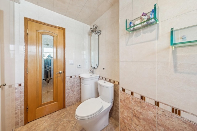 bathroom with toilet and tile walls