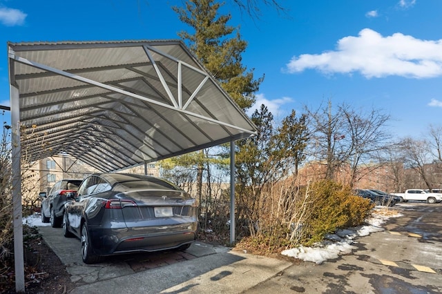 view of vehicle parking with a carport