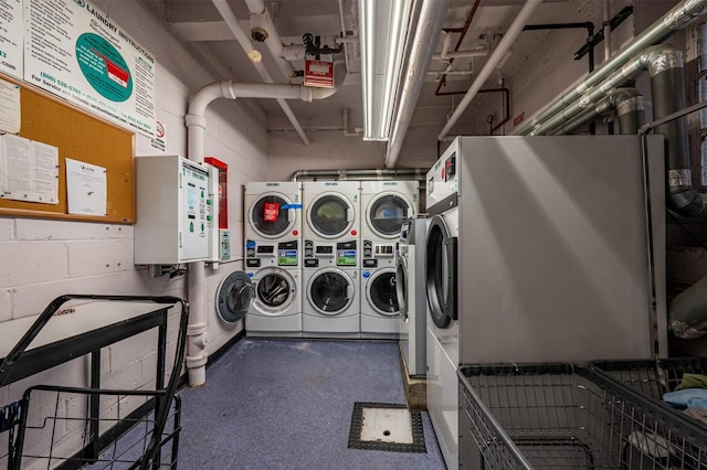 laundry area with stacked washer / drying machine