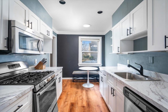 kitchen featuring appliances with stainless steel finishes and white cabinets