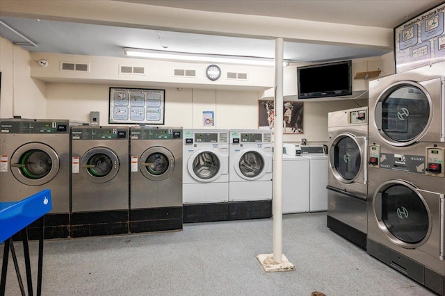 washroom featuring stacked washer / drying machine and independent washer and dryer