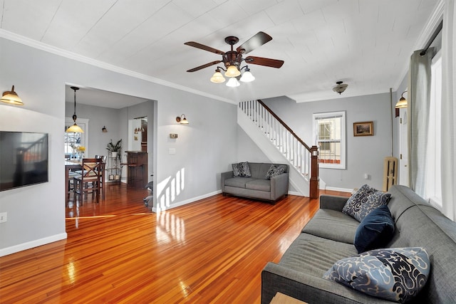 living room with hardwood / wood-style floors and ornamental molding