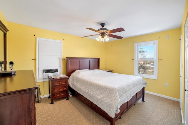 bedroom with ceiling fan and light colored carpet