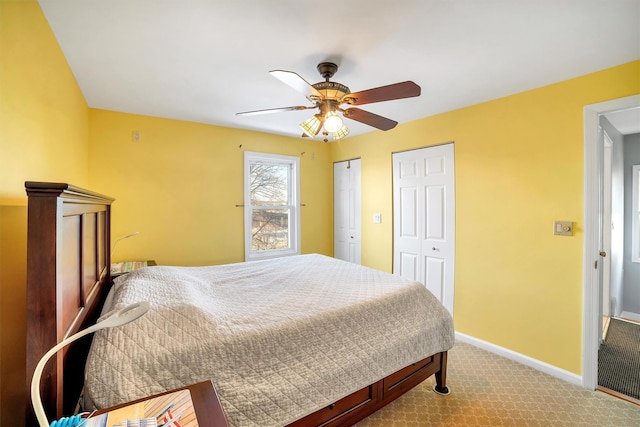 bedroom featuring light colored carpet and ceiling fan