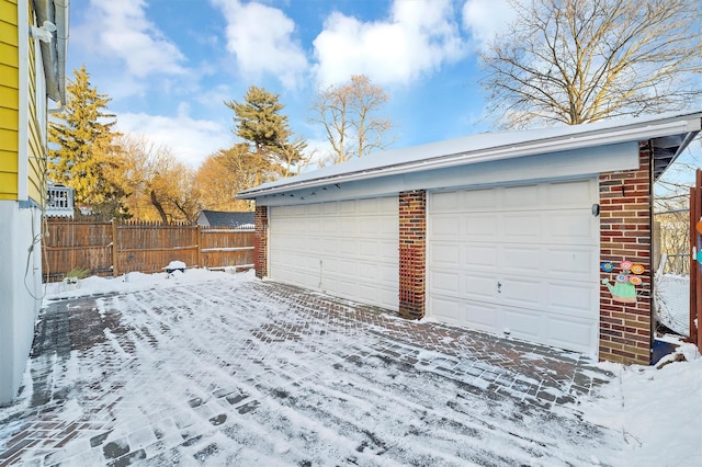 view of snow covered garage