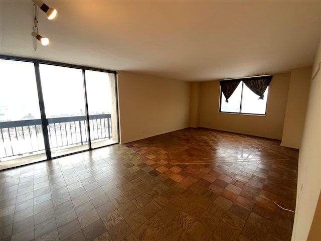 empty room with parquet flooring