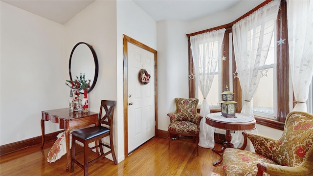 sitting room with light hardwood / wood-style flooring