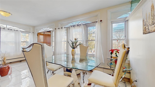 dining room with a baseboard heating unit