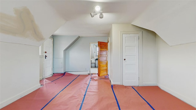 bonus room with vaulted ceiling