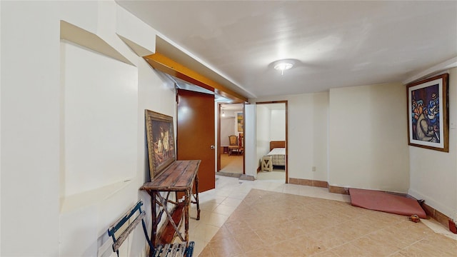 corridor featuring light tile patterned floors