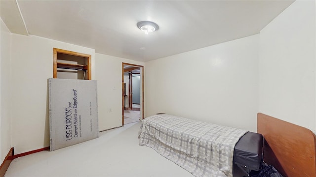 bedroom featuring a closet and light carpet