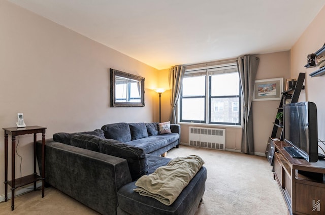 carpeted living room featuring radiator heating unit