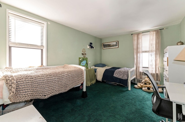 bedroom featuring dark carpet