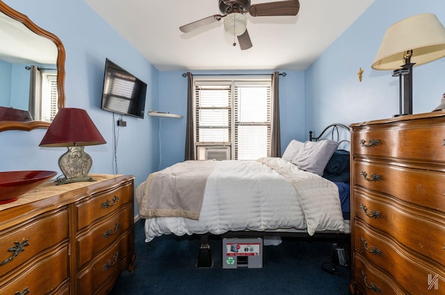 carpeted bedroom with ceiling fan and cooling unit