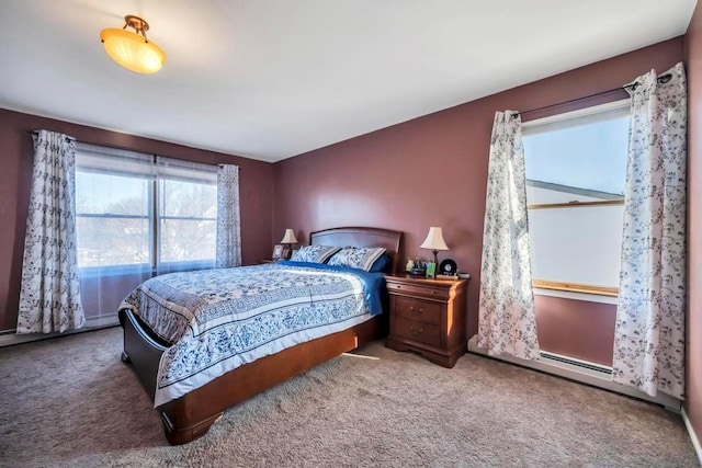 bedroom with carpet and a baseboard radiator