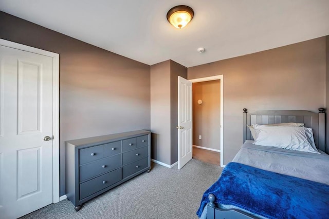 bedroom featuring light carpet