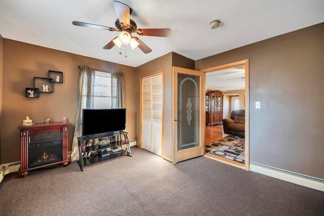 interior space featuring ceiling fan and carpet