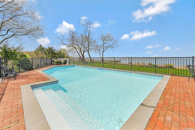 view of swimming pool with a patio