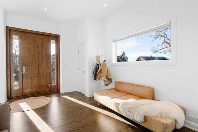 mudroom with baseboards and wood finished floors