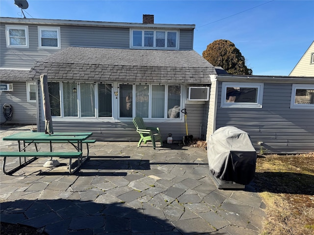 rear view of house with a patio